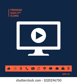 Computer with play button icon