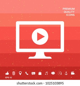 Computer with play button icon