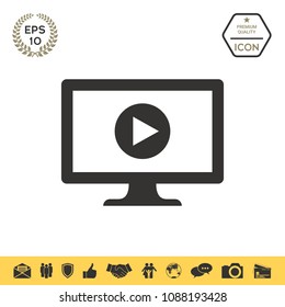 Computer with play button icon