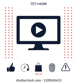 Computer with play button icon