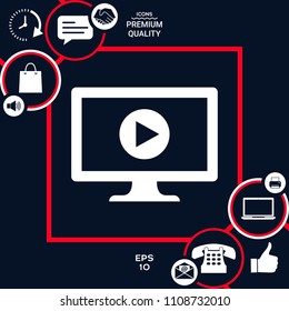 Computer with play button icon