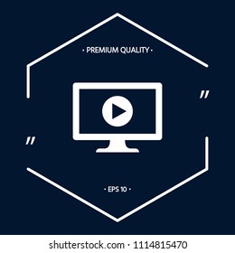 Computer with play button icon