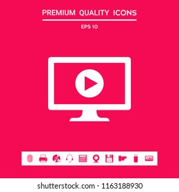 Computer with play button icon