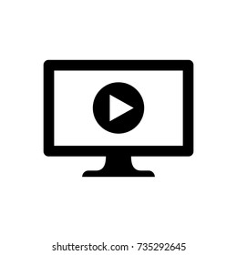 Computer with play button icon