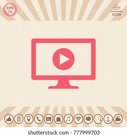 Computer with play button icon