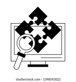computer puzzle and magnifying glass in black and white