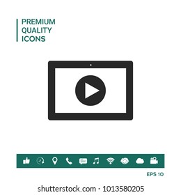 Computer tablet with play button icon