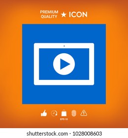 Computer tablet with play button icon
