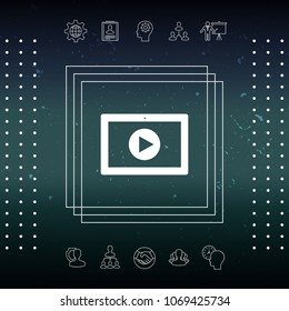 Computer tablet with play button icon