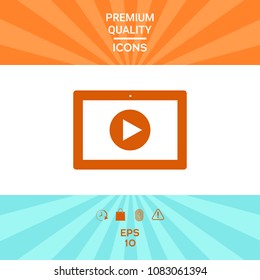 Computer tablet with play button icon