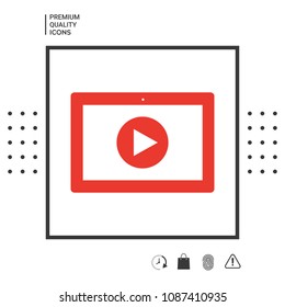 Computer tablet with play button icon