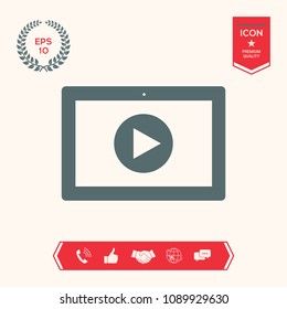 Computer tablet with play button icon