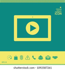 Computer tablet with play button icon