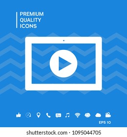 Computer tablet with play button icon