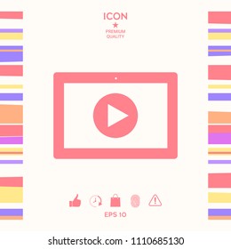 Computer tablet with play button icon