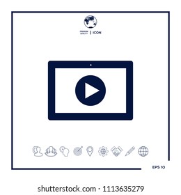 Computer tablet with play button icon