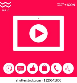 Computer tablet with play button icon