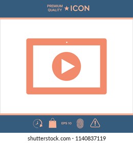 Computer tablet with play button icon