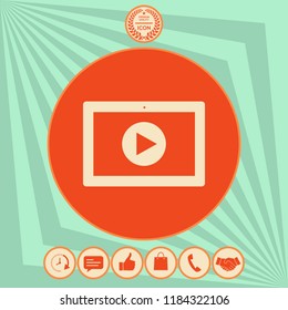 Computer tablet with play button icon