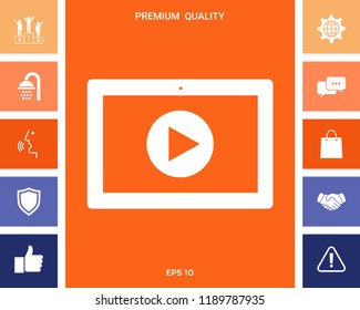 Computer tablet with play button icon