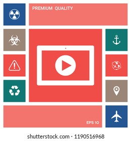 Computer tablet with play button icon