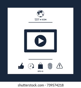Computer tablet with play button icon