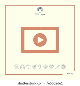 Computer tablet with play button icon