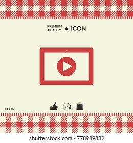 Computer tablet with play button icon