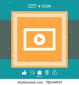 Computer tablet with play button icon