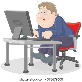 Computer user sitting at his desk in front of a monitor and typing on a keyboard