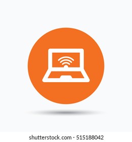 Computer with wifi icon. Notebook or laptop pc symbol. Orange circle button with flat web icon. Vector