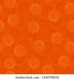 Concentric circles with dotted outline in two colors. Seamless geometric pattern on dark orange background. Vector image