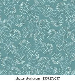 Concentric circles with dotted outline in two colors. Seamless geometric pattern on gray-blue background. Vector image