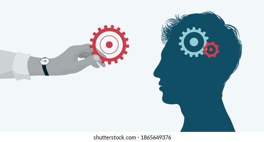 El concepto adquiere asistencia. Curso de aprendizaje. Entrenador sosteniendo un equipo en su mano y poniéndolo en el cerebro de otro hombre como concepto de enseñanza y educación. Terapia psicológica. Carrera