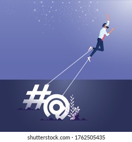 Concept of addiction to social media and online attention-Businessman chained  to a big Commercial At and shape icon
