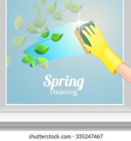Concept background for cleaning service. Hand in yellow glove cleans the window

