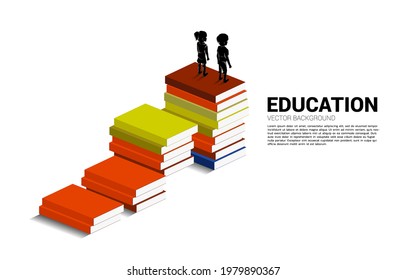 Concept background for power of knowledge. Silhouette of kid standing on stack of books.