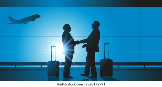 Concept of business travel, with the handshake between two business leaders in the hall of an airport, before boarding their planes.