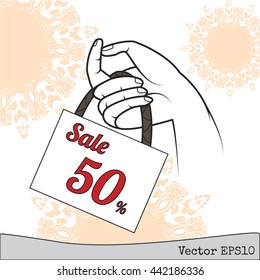 Concept card for sales.thailand art hand holding sale tag.