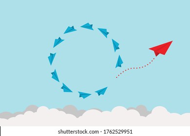 The Concept of Change, Trend, Courage, Creative Solutions, and Innovation – Capturing the Essence of a Red Airplane Changing Direction Amidst Blue Ones in the Sky