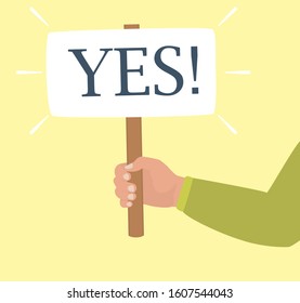 Concept Of Consent. A Human Hand In Green Shirt Holds A Board Saying YES. Symbol Of Decision Making, Positive Choice. Man Or Woman Holding Agree Sign. Vector Cartoon Flat Illustration.