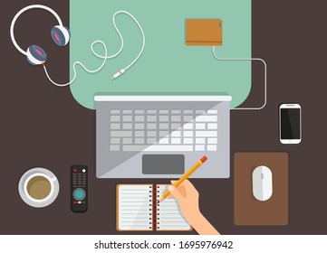 concept coronavirus COVID-19. The company allows employees to work from home to avoid viruses.Online education,distance learning,Workplace with monitor, books, notepad, pencil, tea,pizza. Top view 