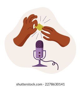 Concept for creating ASMR content. Hands holding a rustling piece of paper near a microphone. Recording pleasant sounds for a blog. 