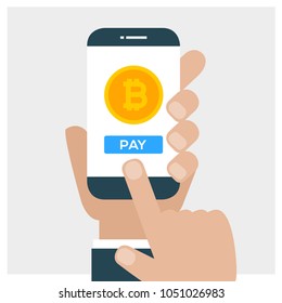 Concept of cryptocurrency technology, bitcoin exchange, mobile banking. Hand holding smartphone and pay with bitcoins