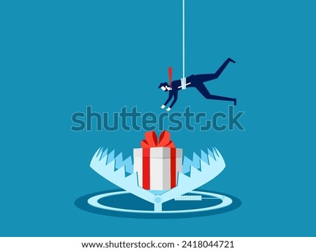 concept of deception or cheating. Businessman tries to pick up a trapped gift box