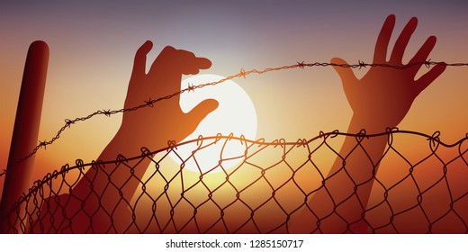 Concept of desperation of refugees fleeing war in their country trying to cross the barbed wire of a border