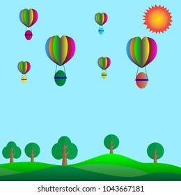Concept Easter Day.Easter eggs on a floating balloon in the sky.Over the mountains and forests