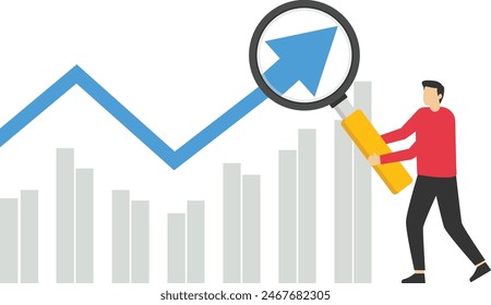 Concept of economic growth with chart and magnifying glass

