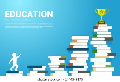 Concept Education and children. Silhouette of kid look up to trophy on stack of books.