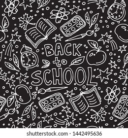 Concept of education. Doodle school symbols with Back to School lettering. Seamless pattern. Design element for fabric, wallpaper or wrapping paper. Hand drawn style.